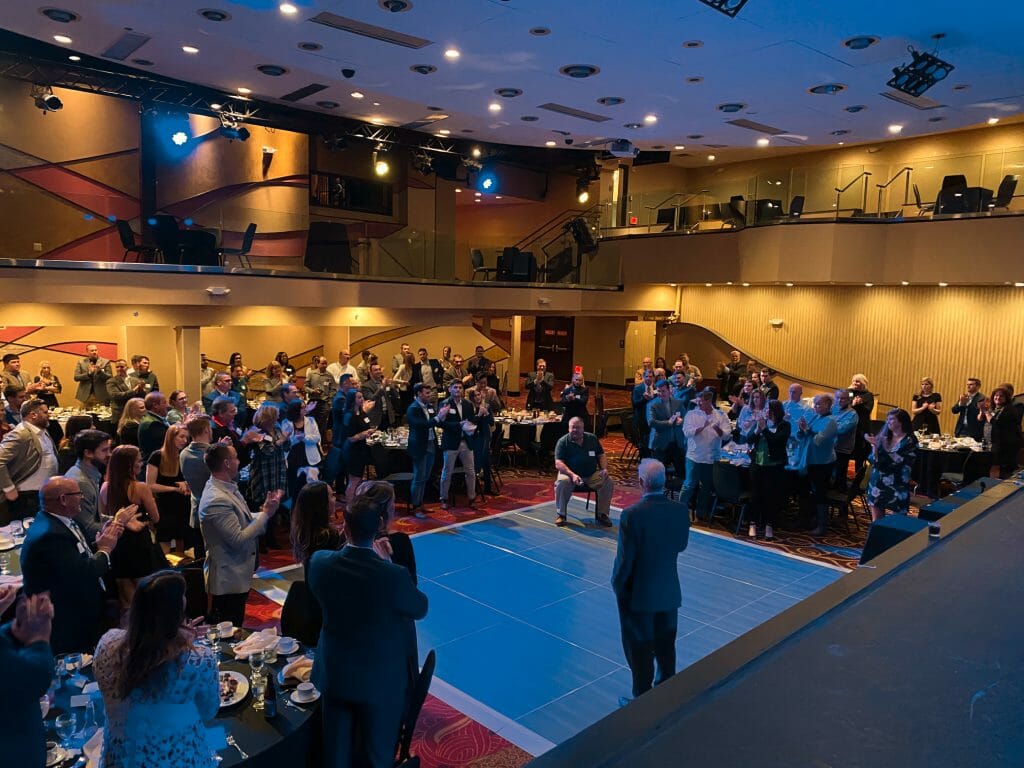 Standing ovation as Rob Steigerwald congratulates Bill Mace at the ARCO 2020 Elite Project Partners Dinner